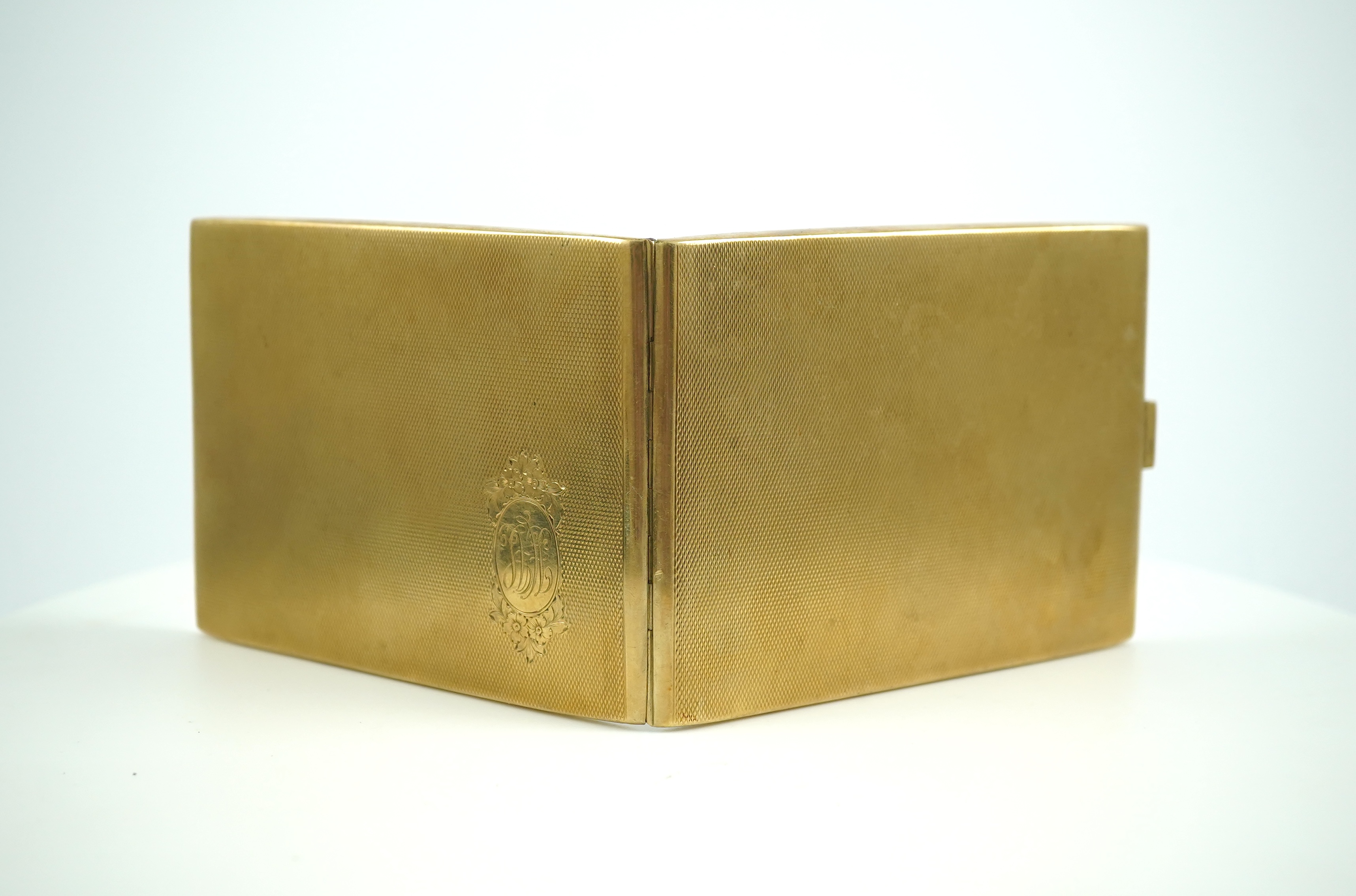 A 9ct gold cigarette case, circa 1929